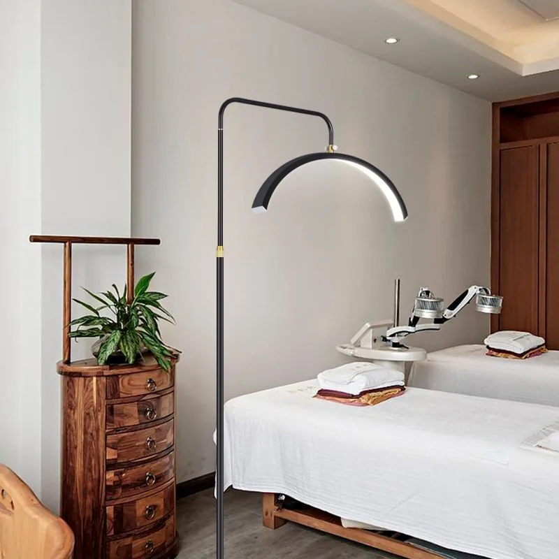 Floor-standing beauty lamp in a salon treatment room
