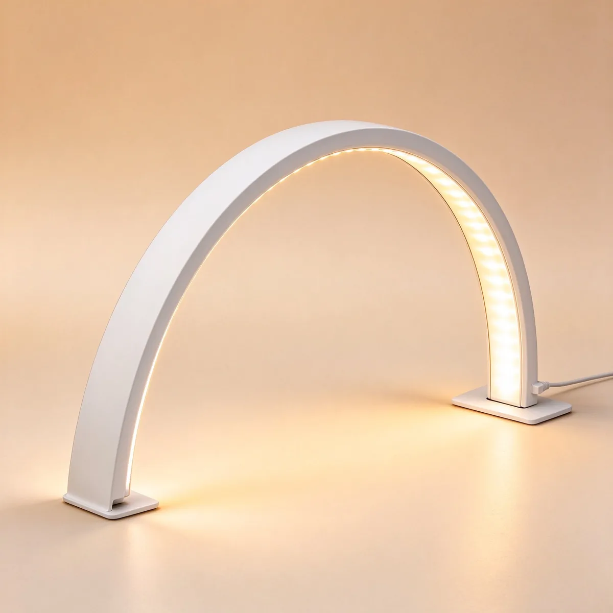 White half moon nail lamp lit up, front view